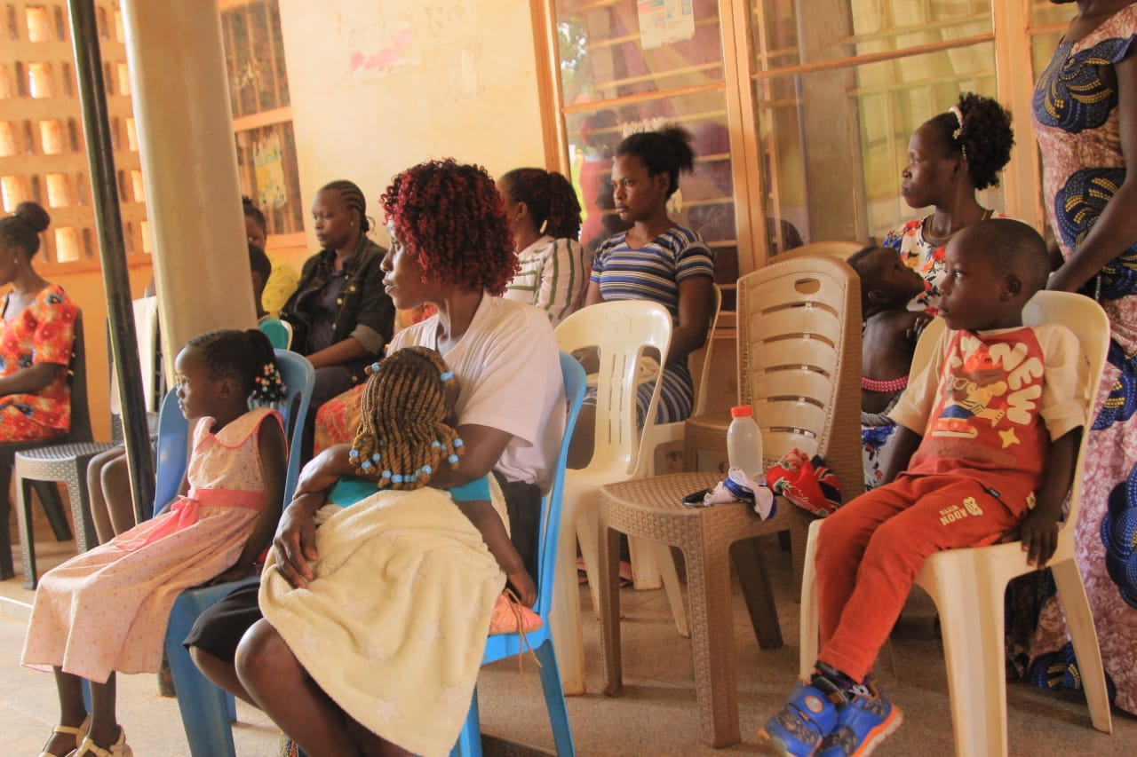Community members seated together during a counselling session